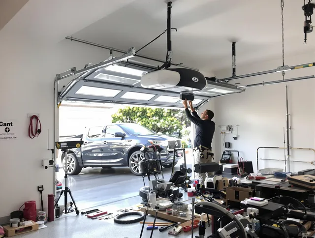 Newtown Garage Door Repair specialist installing smart garage door opener system in Newtown home