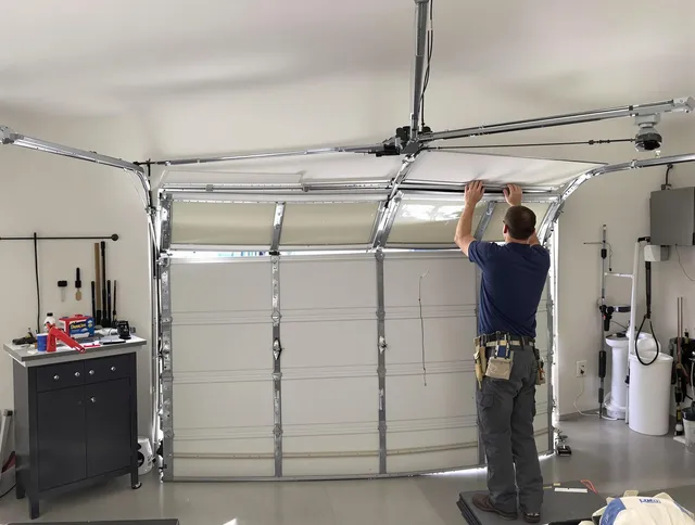 Newtown Garage Door Repair specialist performing precise section replacement on Newtown garage door