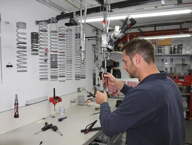 Newtown Garage Door Repair safety certified technician performing precision spring replacement in Newtown
