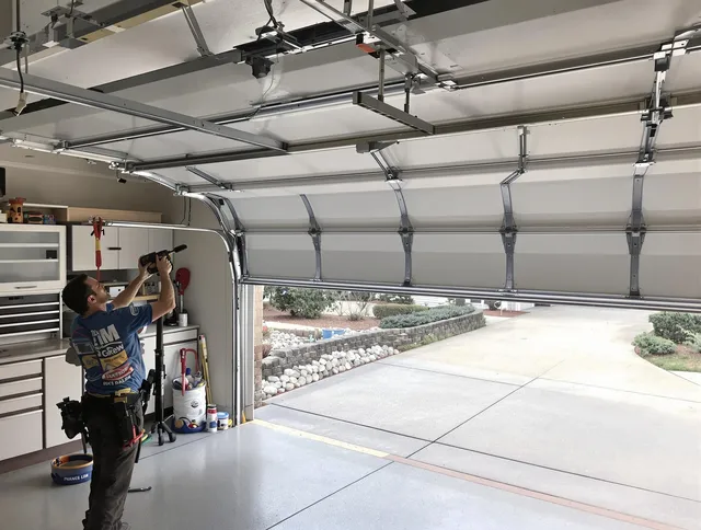Garage door track repair service by Newtown Garage Door Repair in Newtown